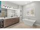 Elegant bathroom featuring a soaking tub and double vanity at 506 Yellow Submarine Ct, Groveland, FL 34737