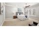 Spacious bedroom with a king-size bed and neutral decor at 506 Yellow Submarine Ct, Groveland, FL 34737