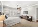 Bright bedroom with large windows and plush carpeting at 506 Yellow Submarine Ct, Groveland, FL 34737