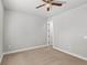 Light-filled bedroom with ceiling fan and carpet flooring at 506 Yellow Submarine Ct, Groveland, FL 34737