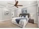 Main bedroom with plush carpet and ensuite bathroom at 506 Yellow Submarine Ct, Groveland, FL 34737