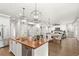 Open concept kitchen with island and breakfast bar at 506 Yellow Submarine Ct, Groveland, FL 34737