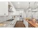 Modern kitchen with stainless steel appliances and butcher block island at 506 Yellow Submarine Ct, Groveland, FL 34737