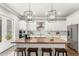 Modern kitchen with stainless steel appliances and butcher block island at 506 Yellow Submarine Ct, Groveland, FL 34737