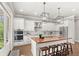 Modern kitchen with stainless steel appliances and butcher block island at 506 Yellow Submarine Ct, Groveland, FL 34737