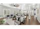 Open living area with hardwood floors, a fireplace, and access to the outdoors at 506 Yellow Submarine Ct, Groveland, FL 34737