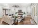 Spacious living area with hardwood floors, a fireplace, and access to the outdoors at 506 Yellow Submarine Ct, Groveland, FL 34737