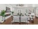 Spacious living room with hardwood floors and a modern fireplace at 506 Yellow Submarine Ct, Groveland, FL 34737