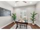 Well-lit office featuring a classic desk, a decorative globe, and large potted plants for a natural feel at 506 Yellow Submarine Ct, Groveland, FL 34737