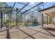 Spacious pool and patio area with screened enclosure at 506 Yellow Submarine Ct, Groveland, FL 34737