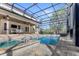 Resort-style pool and spa with expansive covered patio at 506 Yellow Submarine Ct, Groveland, FL 34737