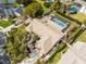 An aerial view of a home featuring a backyard swimming pool, screened-in porch, and meticulously kept landscaping at 534 Sabal Trail Cir, Longwood, FL 32779