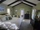 Large main bedroom features vaulted ceilings, dark wood beams, and neutral decor at 534 Sabal Trail Cir, Longwood, FL 32779