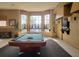 Bright game room with pool table, comfortable seating, and plenty of natural light at 5518 Metrowest Blvd # 104, Orlando, FL 32811