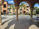 Inviting pool area with shaded seating and lush landscaping, providing a relaxing oasis at 5518 Metrowest Blvd # 104, Orlando, FL 32811