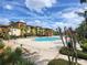 Expansive pool area with multiple seating options and landscaped surroundings, creating a serene environment at 5518 Metrowest Blvd # 104, Orlando, FL 32811