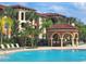 Community pool with gazebo and lounge chairs, surrounded by lush tropical landscaping at 5518 Metrowest Blvd # 104, Orlando, FL 32811
