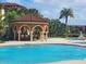 Charming poolside gazebo with bar seating, perfect for entertaining and enjoying the community amenities at 5518 Metrowest Blvd # 104, Orlando, FL 32811