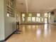 Spacious yoga studio with hardwood floors, mirrors, and natural light at 5518 Metrowest Blvd # 104, Orlando, FL 32811
