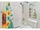 Bathroom with sunflower shower curtain and tub at 6102 Curry Ford Rd # 202, Orlando, FL 32822