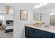 Double vanity bathroom with dark blue cabinets at 6923 Copperwood Ave, Orlando, FL 32829