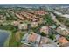 Aerial view of a residential community featuring manicured lawns, a pool, and easy highway access at 7189 Regina Way, Orlando, FL 32819