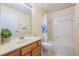 Bathroom with a shower-tub combo and single sink vanity at 7189 Regina Way, Orlando, FL 32819