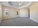 Bright bedroom with neutral walls, carpet flooring, and ample closet space at 7189 Regina Way, Orlando, FL 32819