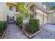 The house features a well-maintained brick pathway and stone accents at 7189 Regina Way, Orlando, FL 32819