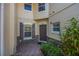 Stylish entrance with a brick walkway, stone accents and a welcoming front door at 7189 Regina Way, Orlando, FL 32819