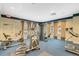 Community fitness center features modern equipment and a mirrored wall at 7189 Regina Way, Orlando, FL 32819