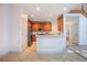 Bright kitchen featuring wooden cabinets, tiled flooring, and stainless steel appliances at 7189 Regina Way, Orlando, FL 32819