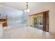 Spacious living room with tiled floors, a large sliding glass door, and tall ceilings at 7189 Regina Way, Orlando, FL 32819