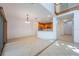 Spacious living room with tile floors, high ceilings, and an open-concept kitchen at 7189 Regina Way, Orlando, FL 32819