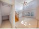 Open living room with high ceilings, large windows, and staircase at 7189 Regina Way, Orlando, FL 32819
