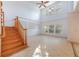Spacious living room featuring vaulted ceiling, fan, and natural light at 7189 Regina Way, Orlando, FL 32819