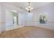 Open living room with neutral carpet and paint at 7189 Regina Way, Orlando, FL 32819