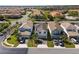 Aerial view of beautiful homes and neighborhood with palm trees and blue sky at 7343 Oakmoss Loop, Davenport, FL 33837