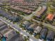 Overhead neighborhood view showcasing houses, palm trees and a well maintained community at 7343 Oakmoss Loop, Davenport, FL 33837
