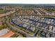 Wide aerial perspective of a neighborhood featuring contemporary homes, manicured yards, and easy access to nearby amenities at 7343 Oakmoss Loop, Davenport, FL 33837