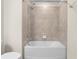 Bathroom with shower and tub combo at 7343 Oakmoss Loop, Davenport, FL 33837