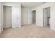 Spacious bedroom with neutral carpet, closet, and ensuite bathroom at 7343 Oakmoss Loop, Davenport, FL 33837