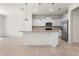 Bright kitchen with granite countertops, stainless steel appliances, and stylish pendant lighting at 7343 Oakmoss Loop, Davenport, FL 33837