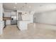Spacious kitchen with stainless steel appliances, granite countertops, and an open floorplan at 7343 Oakmoss Loop, Davenport, FL 33837