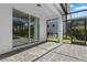 Covered patio with brick floor, and a view of backyard and pool at 7343 Oakmoss Loop, Davenport, FL 33837