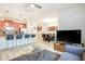Open-concept living space with a modern kitchen, dining area, and cozy living room for Gathering time at 9023 Dogleg Dr, Davenport, FL 33896
