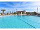 Resort-style swimming pool with plenty of lounge chairs at 9023 Dogleg Dr, Davenport, FL 33896