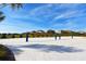 A sand volleyball court with views of the surrounding community at 9023 Dogleg Dr, Davenport, FL 33896