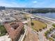 Expansive aerial view of an apartment complex near a highway, showing the surrounding cityscape and waterways at 911 N Orange Ave # 352, Orlando, FL 32801