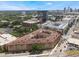 Extensive aerial view of an apartment complex, with city skyline and surrounding infrastructure in the background at 911 N Orange Ave # 352, Orlando, FL 32801